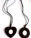Assorted shape black cord necklace motif Shiva's eye seashell in the center on the pendant