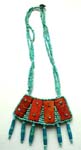 Muliple string seed bead necklace with rectangular leather decoration on fan shape beaded pendant, imitation leather back