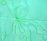 Solid green embroidered sarong wrap with tropical flower pattern