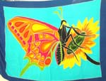 Assorted color thick rayon sarong wrap with butterfly rested on a sun flower