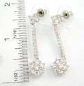 Brass base studs earring motif a clear cz cube with pole holding a clear cz flower at the bottom