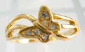 Triple curved line gold ring motif a clear cz butterfly in the center