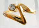 Thunder shape gold ring holding a mini round clear cz on top and 4 mini clear cz embedded on each side