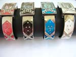 Enamel wrist bangle watch motif in long rectangular clock face and X shape inlaid on clock face and bangle, design in assorted color
