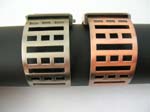 Multi cut-out rectangular bangle watch motif in rectangular clock in black and copper color