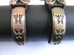 Copper and shiny brown color cuff wrist watch motif in butterfly clock face