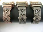 Cobblestone rectangular fashion bangle watch with shimming assorted mother of pearl dial design and filigree pattern on bangle