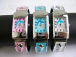 Pink, blue and white rectangular cuff watch with dolphin feature on clock face and multi silver dolphin inlaid on bangle