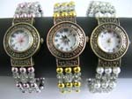Assorted beaded bangle fashion watch with round watch face design and maple leaf on watch face