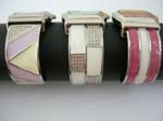 Enamel cuff bangle watch with square clock face and assorted design on bangle