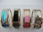 Fashion cuff bangle watch with rectangular assorted color clock face and sequins on bangle design