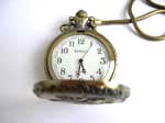 Bronze color pocket watch with white clock face and dragon inlaid on cover