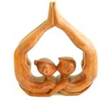 Kissing couple abstract carving in genetic position band their body and holding legs over head