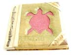 Rectangular photo album with rope on side and pinky sand turtle, made of natural material such as banana leaf, mulberry papers, recycling papers, etc.