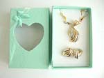 Rectangular shape connected necklace jewelry set with ribbon knot design in two tone color, matched with a pair of earring and a green gift box included