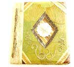 Banana leaf notebook with curvy rope flower and diamond shape motif white flower in the center, made of natural banana leaf, tree sticks, mulberry papers, recycling paper etc. 