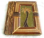 Rectangular photo album with tree stick on side and coconut tree central design, made of natural material such as banana leaf, mulberry papers, recycling papers, etc., assorted design randomly pick