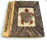 Rectangular photo album with tree stick on side and rope turtle central design, made of natural material such as banana leaf, mulberry papers, recycling papers, etc. 