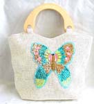 White canvas fabric with sequins wooden handle hand bag motif butterfly feature in sparkle chips and thread work design with zipper closure 