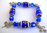 Fashion stretchy blue bracelet with multi white greenhand-painted Chinese lampwork glass bead and silver beads handing a cross charm design