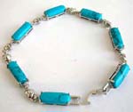 Turquoise fashion bracelet in long shape connected with silver heart design and chain lock for closure