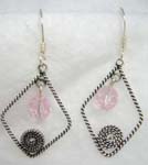 Twisted sterling silver open diamond shape fish hook earring hanging a pink crystal and spiral pattern in the middle