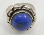 925.sterling silver ring with twisted silver covering a circular lapis