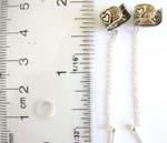 Genius 925.sterling silver ear clip earring with long chain holding a 