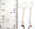 Sterling silver fish hook earring with long chain holding a dolphin figure