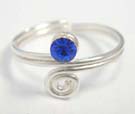 Spiral motif, single band toe ring from 925 sterling silver holding blue cz stone