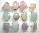 Pastel colored rose quartz, amethyst or jade gemstones on 925. sterling silver rings that come in an assortment of colors and shapes picked randomly by our warehouse staff 