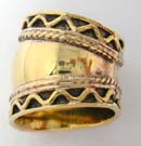 Trendy bronze ring with wave design framing solid, sheen center 