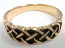 Celtic knot band encircling bronze ring 