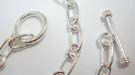 Large chained 925. sterling silver necklace with bar bell and hoop closure