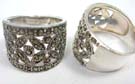 Vintage style, wide ring in cut out floral design embedded with gemstones and decorated with 925. sterling silver circles