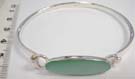 Sexy 925. sterling silver bangle bracelet with crafted emerald gemstone in oval shape