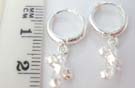 Cute 925. sterling silver hoop earrings with dangling cross decorated with hollowed outlet circles 
