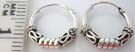 Coiled design framed by wave motif in small 925. sterling silver hoop earrings