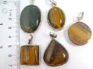 Stylish tigers eye stoned 925. sterling silver pendant. Comes in an assortment of colors and shapes picked randomly by our warehouse staff