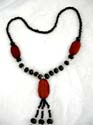 Western twisted black cord lady's fashion necklace with coconut pendant and fringe style design