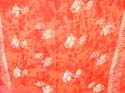 Tie dye stamped orange sarong with fishes, sun, daisy and seashell pattern