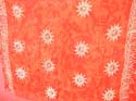 Tie dye stamped orange sarong with fishes, sun, daisy and seashell pattern
