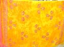 Tie dye yellow sarong with seashell, sun and flower