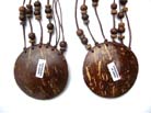 Balinese style circular wooden pendant on multi string necklace decorated with beads 