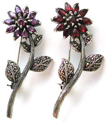 Our jeweled pins and semi-precious stone jewelry are made by skilled crafts people in Thailand or Indonesia.  We have beautifully made, elegant quality pins and brooches with garnet, ametyest, cz in flower designs, boat, elephant, Celtic knot, peacock, horse, turtle, lizard, butterfly and much more.