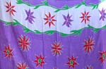Purple color with orange flower and red and purple decor each side 