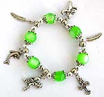 Green beaded strecthy charm bracelet with cross, leaf, dolphin, and Apolo angel pattern 