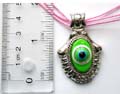 Fashion necklace in triple pinkish string design with a green elliptical evil eye pattern central decor metal pendant at center